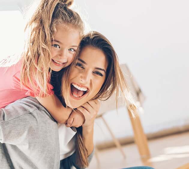 happy mom with daughter