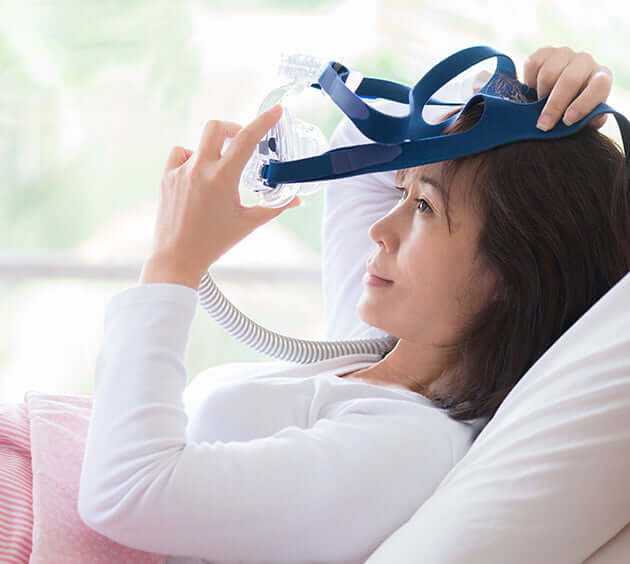 woman putting appliance on