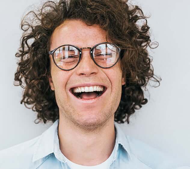 happy man with curly hair