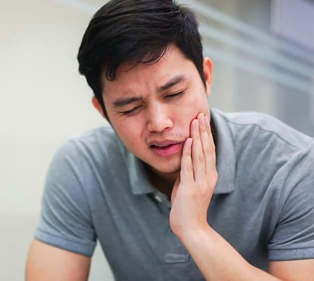 man with mouth pain