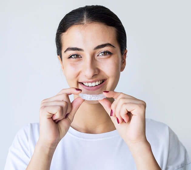 smiling woman with custom mouthguard