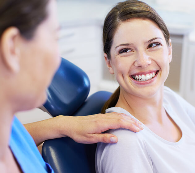 smiling woman sitting in a dental chair