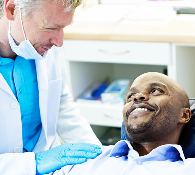 dentist talking with a patient