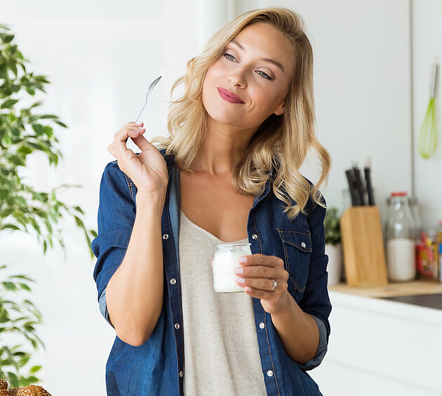 woman eating yogurt