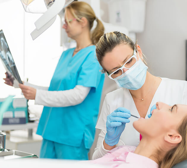 dentist examining a patient's mouth