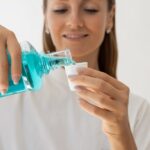 woman using mouthwash, is mouthwash necessary